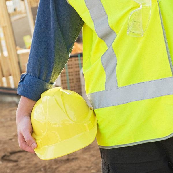 Contstruction worker holding a hard hat